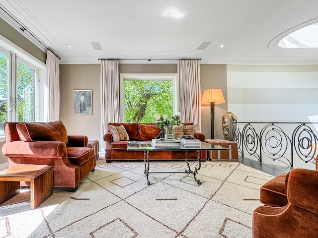 living area featuring visible vents, recessed lighting, and ornamental molding