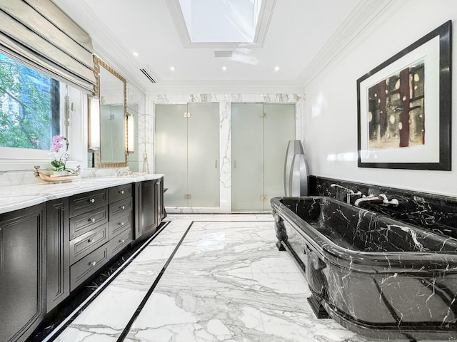 bathroom featuring a soaking tub, recessed lighting, a stall shower, ornamental molding, and marble finish floor