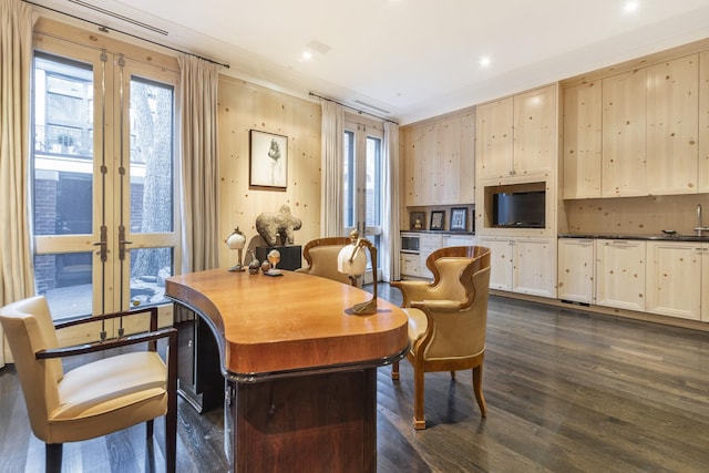 dining space with dark wood finished floors and french doors