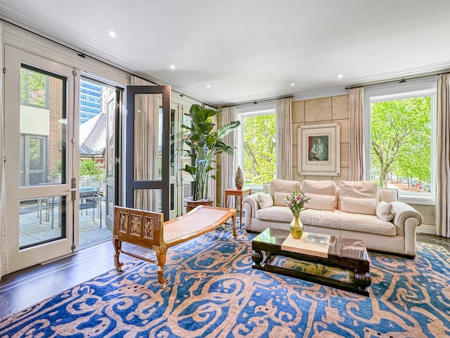 living room with recessed lighting, wood finished floors, and ornamental molding