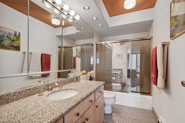 full bath with toilet, baseboard heating, combined bath / shower with glass door, vanity, and recessed lighting