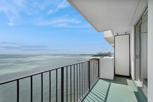 balcony featuring a water view