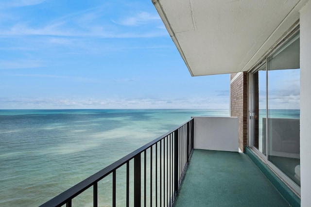 balcony featuring a water view