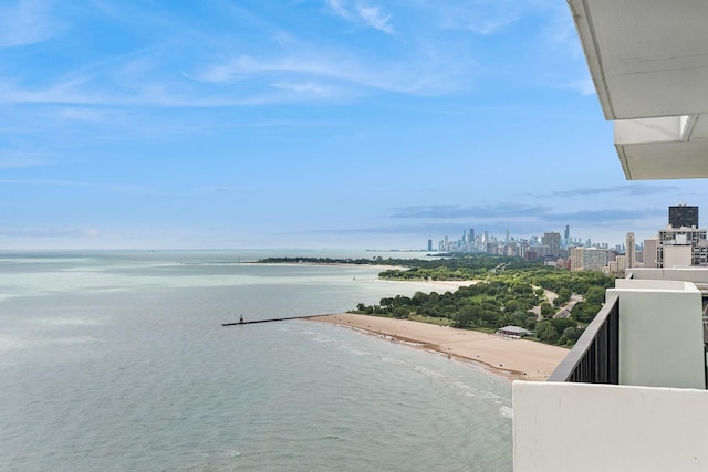 view of water feature featuring a view of city and a beach view