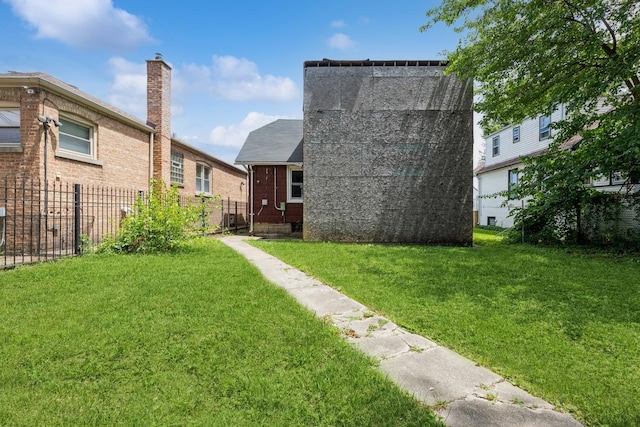 back of house with a yard