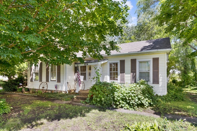 view of front of house with roof with shingles