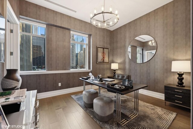 office featuring a notable chandelier and hardwood / wood-style floors