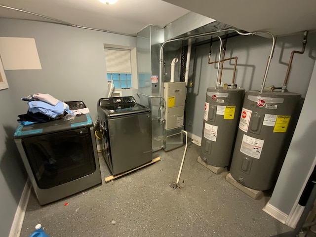 utility room featuring electric water heater and washer and clothes dryer