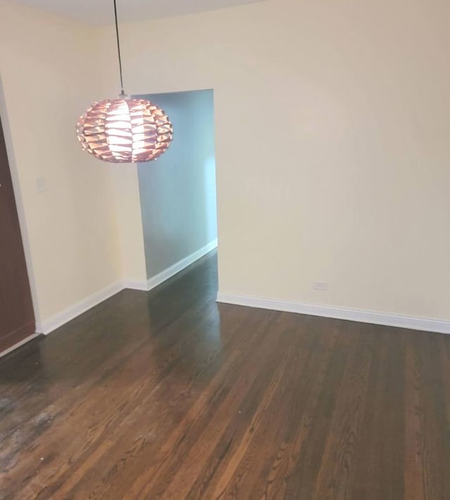 6639 S Rhodes Ave, Chicago, IL 60637 - unfurnished dining area with dark wood-type flooring and a chandelier