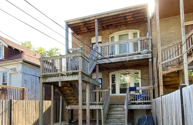 back of house featuring a balcony