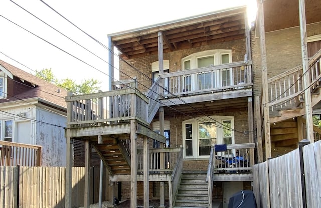 6639 S Rhodes Ave, Chicago, IL 60637 - rear view of property featuring stairway, brick siding, and a balcony
