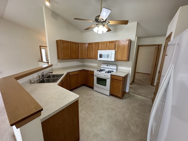 kitchen with kitchen peninsula, white appliances, high vaulted ceiling, and sink