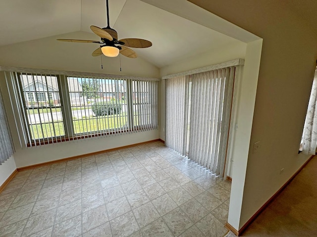 unfurnished sunroom with ceiling fan and lofted ceiling