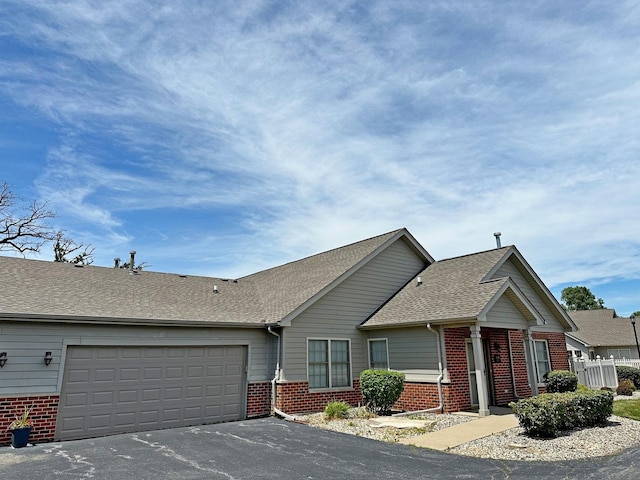 ranch-style home featuring a garage