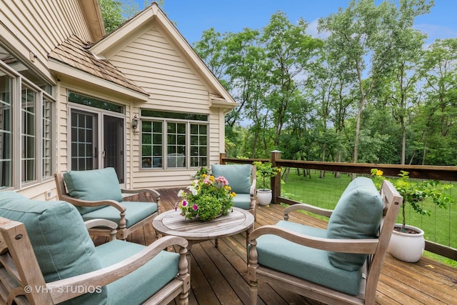 wooden deck featuring a lawn and an outdoor hangout area