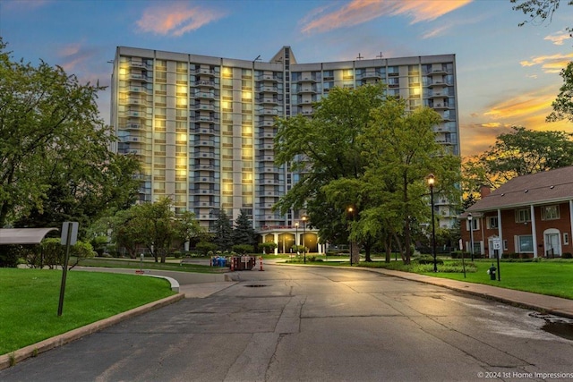 view of outdoor building at dusk