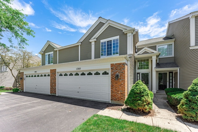 townhome / multi-family property featuring a garage