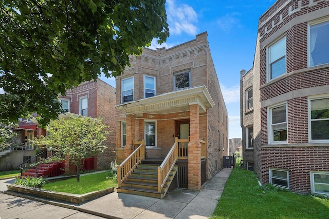 view of front of house featuring brick siding