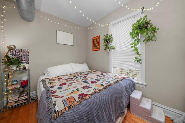 bedroom with hardwood / wood-style flooring