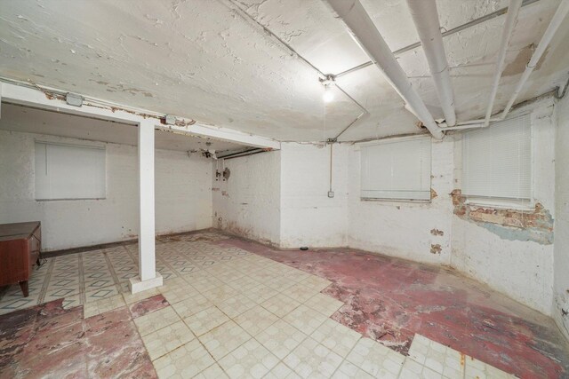 basement featuring light tile patterned floors