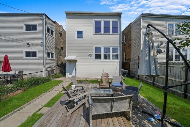 rear view of property with an outdoor hangout area and a wooden deck