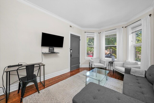 living room featuring ornamental molding and hardwood / wood-style floors