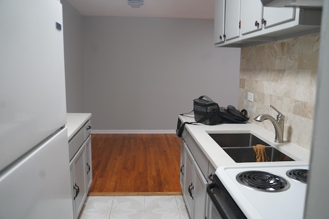 kitchen featuring exhaust hood, white appliances, tasteful backsplash, and sink