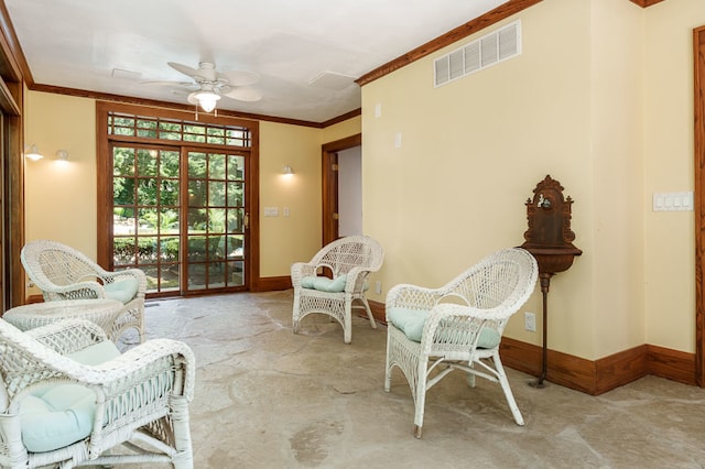 living area with concrete flooring, ceiling fan, and ornamental molding