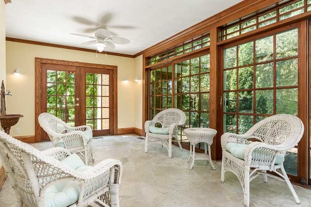 sunroom featuring french doors and ceiling fan