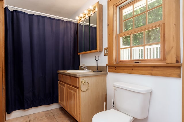 bathroom with tile patterned floors, vanity, and toilet