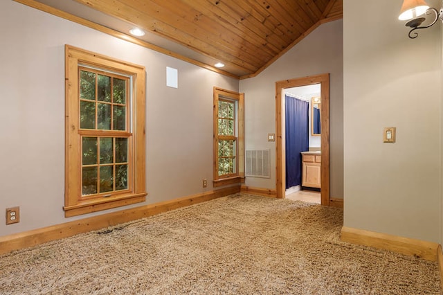 spare room with wood-type flooring, lofted ceiling, plenty of natural light, and wood ceiling