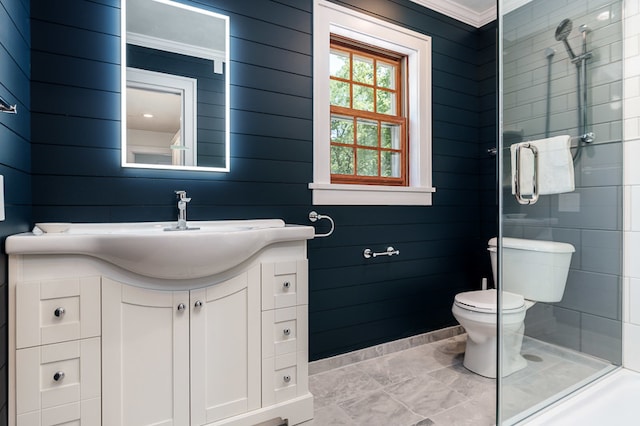 bathroom featuring tile patterned flooring, walk in shower, toilet, vanity, and ornamental molding