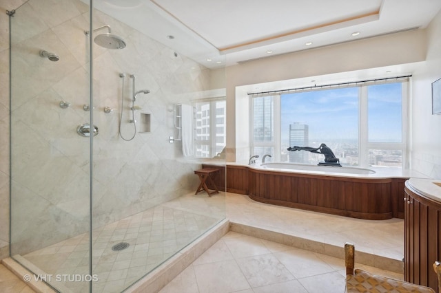 bathroom with tile patterned floors, separate shower and tub, and a healthy amount of sunlight