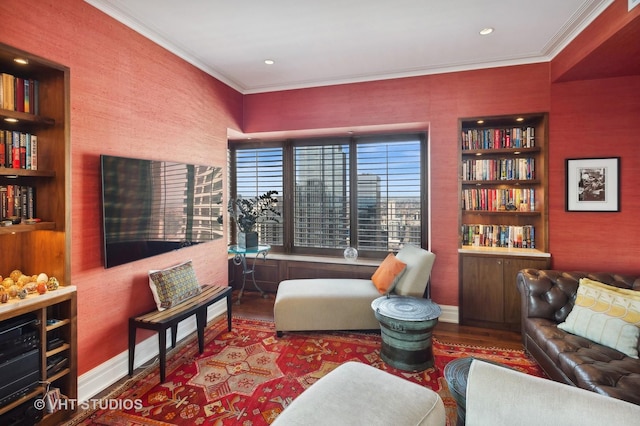 living room featuring built in shelves, crown molding, and wood-type flooring