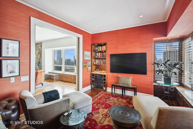 living room featuring crown molding and light hardwood / wood-style floors