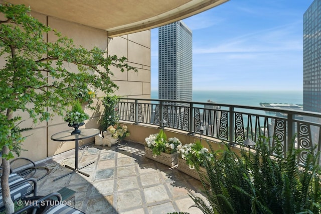 balcony featuring a water view