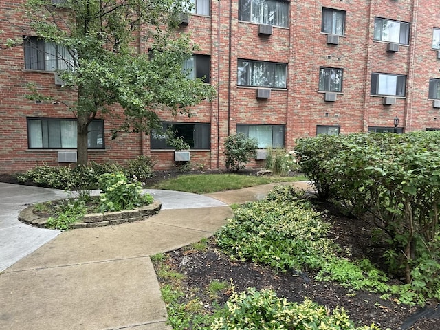 view of property featuring a wall mounted AC