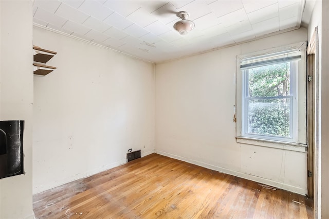 spare room with hardwood / wood-style floors