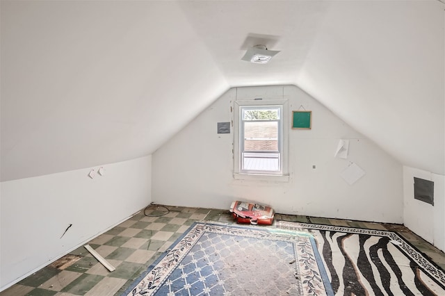 additional living space featuring lofted ceiling