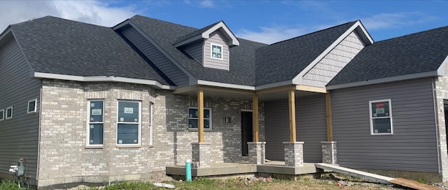 back of property with a porch