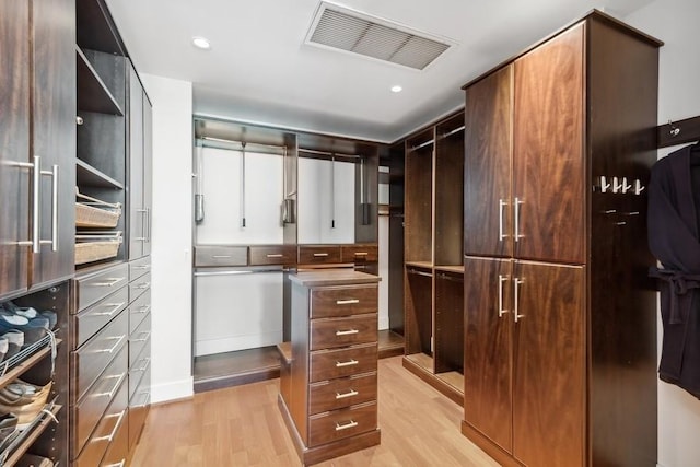 spacious closet featuring light wood-type flooring