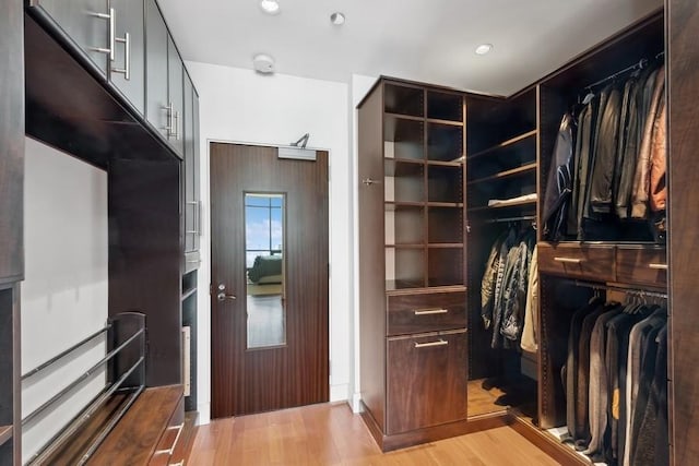 walk in closet featuring light wood-type flooring