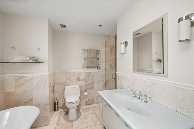 full bathroom with vanity, toilet, tile walls, and plus walk in shower