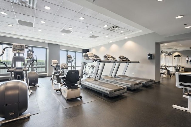 workout area featuring a drop ceiling