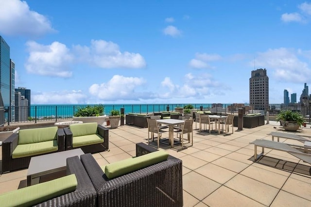 view of patio featuring outdoor lounge area and a water view