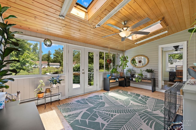 sunroom featuring ceiling fan, wooden ceiling, and a healthy amount of sunlight