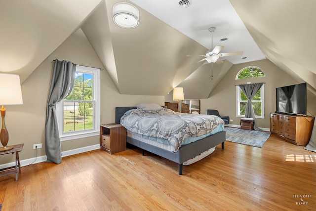 bedroom with lofted ceiling, ceiling fan, and light hardwood / wood-style floors