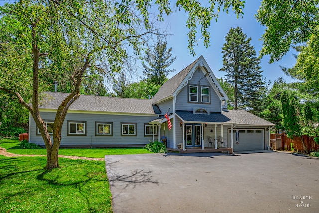 view of front of house with a garage and a front yard