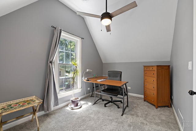 carpeted office space featuring lofted ceiling and ceiling fan