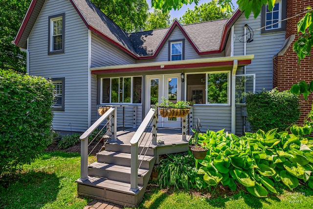 back of house with a deck